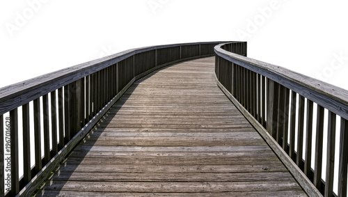 Canvas Print Isolated rustic wooden boardwalk with handrails for walking, leading into a curv