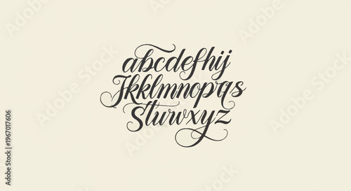 Elegant script typeface alphabet showcasing decorative flourishes and calligraphic styling