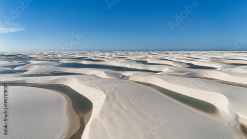 Aerial view of white sand dunes and freshwater lagoons in Lencois Maranhenses National Park, Brazil