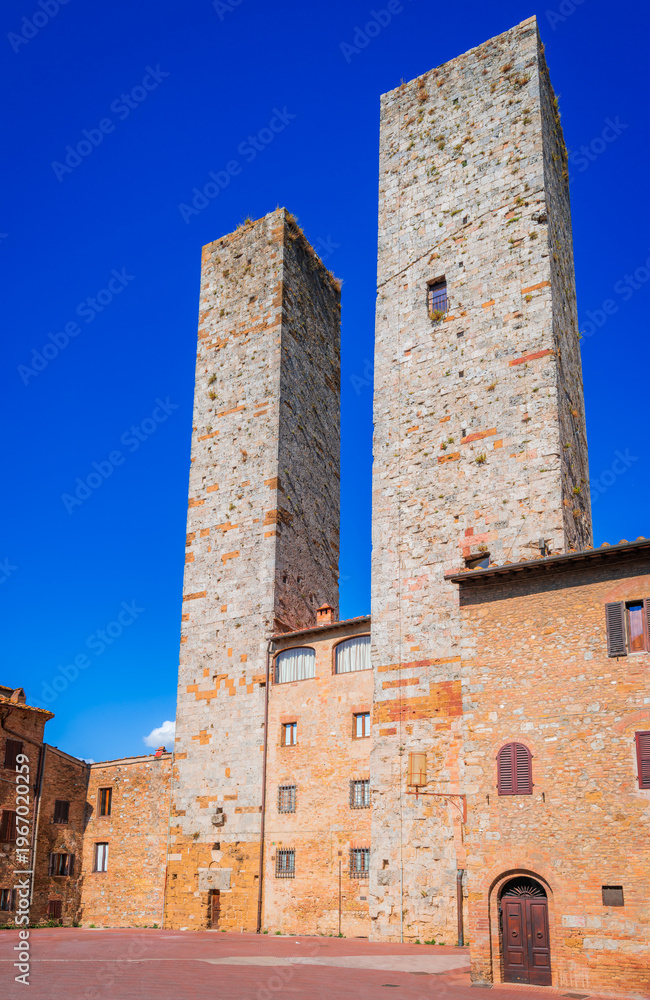 Fototapeta premium Tuscany, Italy. Piazza delle Erbe and Torre Salvucci in San Gimignano.