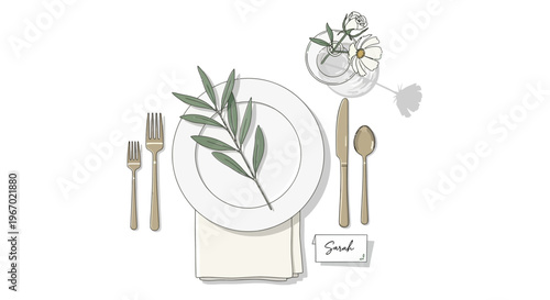 Elegant table setting with floral garnish, name card, and golden cutlery - top view