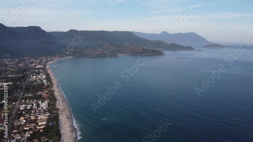 Aerial 4K wide view of Maresias beach coastline and mountains in Sao Sebastiao, Brazil