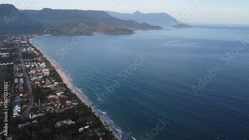 Aerial 4K wide view of Maresias beach coastline and mountains in Sao Sebastiao, Brazil