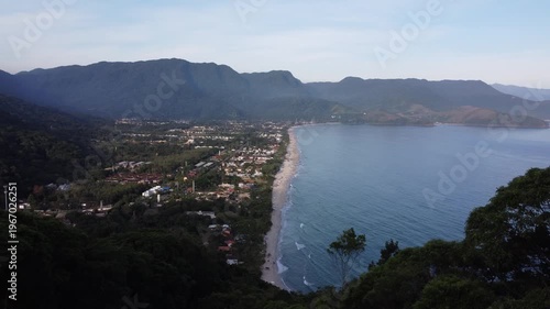 Aerial 4K wide view of Maresias beach coastline and mountains in Sao Sebastiao, Brazil