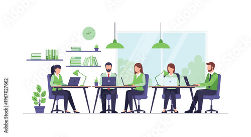 Five people are working on laptops at two long desks in a bright office with green accents and a large window.