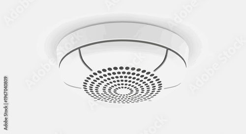 White circular ceiling-mounted sensor with a patterned grille