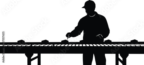 Silhouette of a factory worker at a production line industrial labor manufacturing