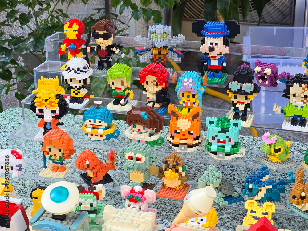 Obraz premium Taiwan, Taipei City, January 3, 2026 – Close-up of LEGO Mickey Mouse, Iron Man, Pikachu, and Anime Figures Outdoors