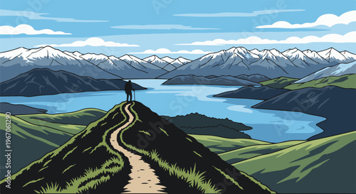 Lone hiker stands atop a green hill overlooking a vast lake and snow-capped mountains