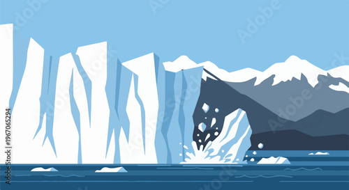 Iceberg breaking apart and calving into the ocean with mountains in background
