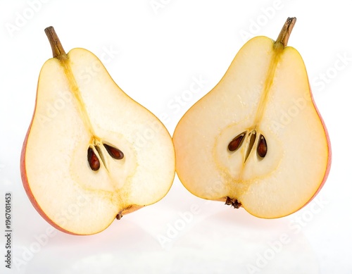 A halved pear reveals its inner structure, showcasing seeds and flesh with a gradient from red to pale yellow. The background is white