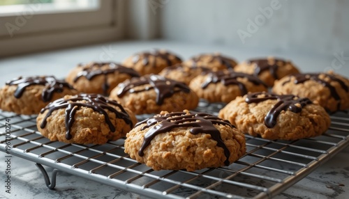 Freshly Baked Cookies Drizzled with Chocolate on a Cooling Rack in a Cozy Kitchen Setting