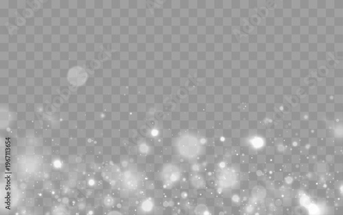 White sparkling dust floats over a dark blurred background, blending soft bokeh and luminous highlights for festive or magical visuals.