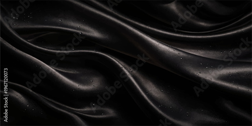 Elegant black satin fabric with smooth silk waves creates a luxury textile backdrop featuring a shiny texture and soft purple drapery for fashion decoration