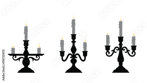 Three black vintage candelabras with lit grey candles providing soft light against a white background for elegant and gothic home decor.