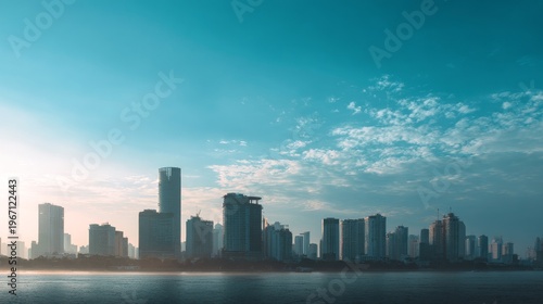 Wallpaper Mural Sunrise over a misty cityscape with urban skyline reflecting in calm water. Torontodigital.ca