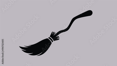 Simple black silhouette of a witch's flying broomstick with a curved handle against a plain light purple background.