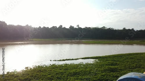 Murky water in a dam area showing sediment and low clarity. The scene highlights environmental conditions and water quality in a reservoir setting.