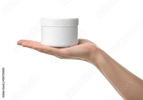 A hand holding a small white jar with a screw-on lid against a plain background