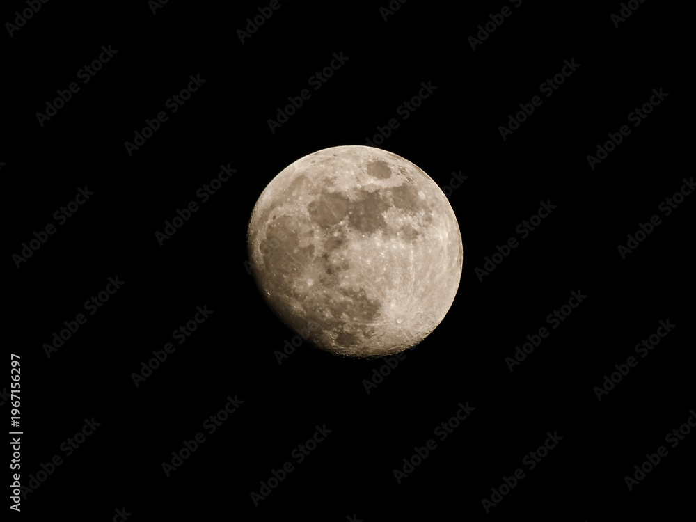 Obraz premium Close up of almost full moon with visible craters in the lower side is the orbit. Places and space photography. Front side of the moon. 