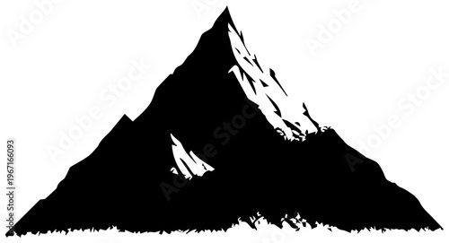 A large mountain with snow on its peak