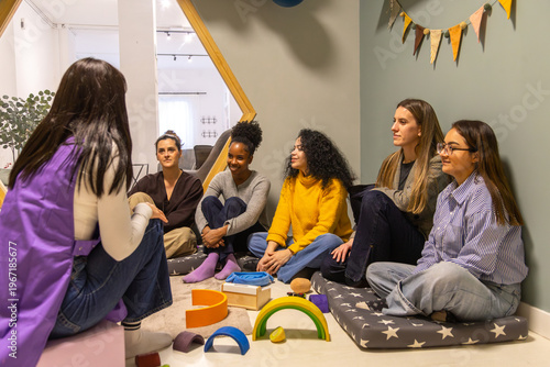 Group of women listening in educational setting