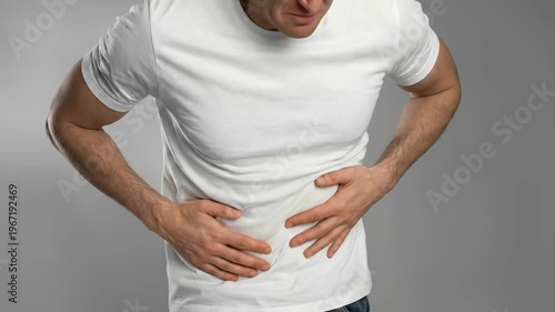 Adult male experiencing severe liver pain, acute abdominal discomfort, symptoms of internal organ disease, critical health condition, urgent medical concern, distress