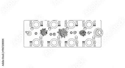 Overhead view of a formally set table with place settings and floral centerpieces