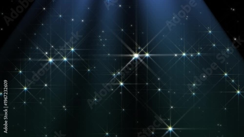 Sparkling light dust particles star with spotlight rays shining down background.