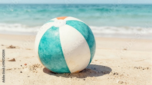 Colorful Beach Ball on Sandy Shore with Gentle Ocean Waves and Clear Blue Sky