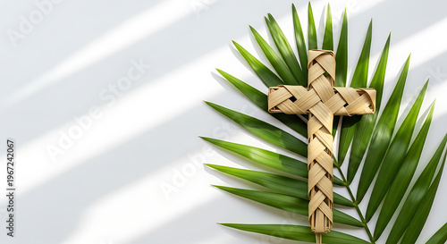 Braided palm leaf cross and green fronds on white, symbolizing Christian faith and spiritual devotion