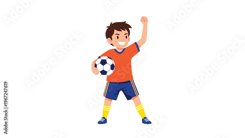 Young boy in an orange soccer jersey celebrates his victory while holding a football and raising his fist against a white background.