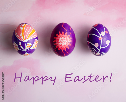 Easter composition with beautiful Easter eggs painted in pink, lilac and violet colors with unique design