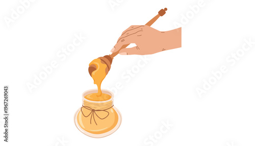 A hand holding honey dipper over a jar of golden honey