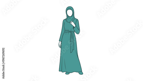 A woman wearing a green hijab and abaya standing alone