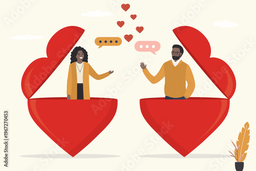Happy diverse man and woman stand inside large open hearts, engaging in friendly conversation with speech bubbles and small hearts above them. Emotional openness and dating