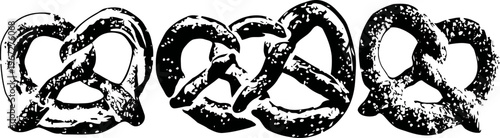 three rustic pretzels with coarse salt on a white background, traditional baked snacks