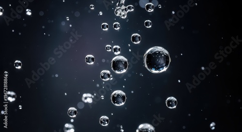 Water droplets splashing in the air against dark background