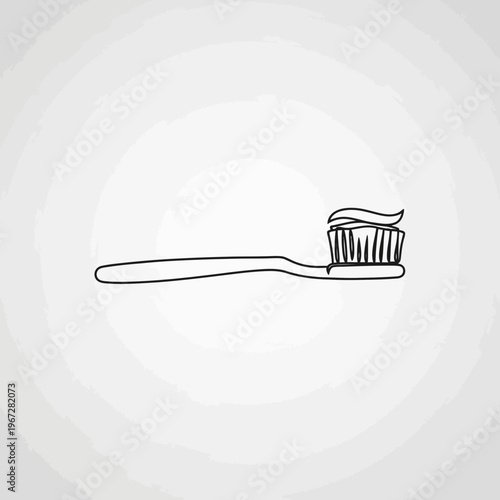 Simple toothbrush with toothpaste ready for oral hygiene routine.