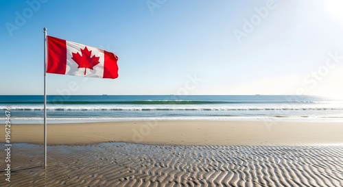 Vibrant Canadian flag waves on a sunny beach during Canada Day celebrations with ocean waves and sandy shore.