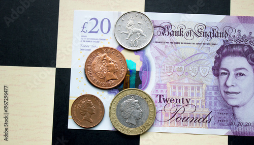 British pounds close-up on a chessboard background. National currency of Great Britain