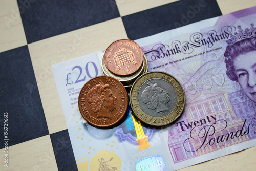 British pounds close-up on a chessboard background. National currency of Great Britain