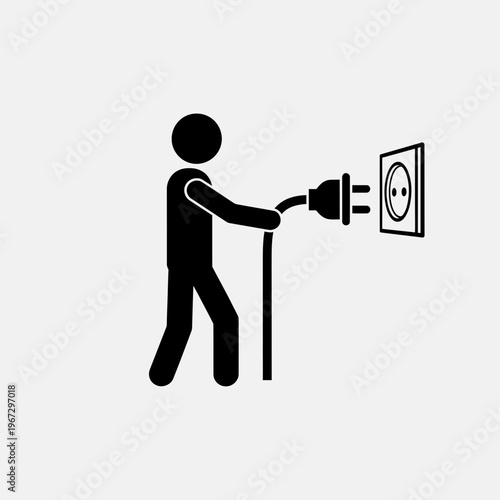 Person plugging in electrical plug into wall socket for power.