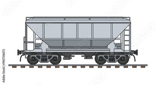 Side view of a grey industrial railway hopper car on tracks for transporting bulk goods and materials.