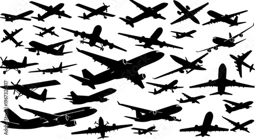 Silhouettes of various airplanes flying in the sky.