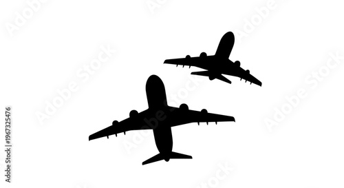 Two airplanes flying in the sky silhouette.