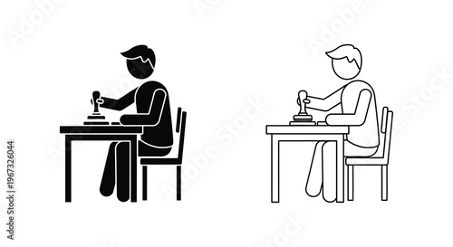 A men in a stamp on the table designs one dark and one light silhouette