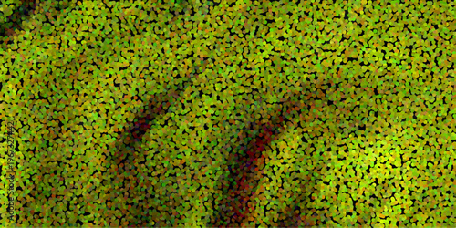 Photography Vibrant abstract pointillist texture of lush green foliage with subtle red and b