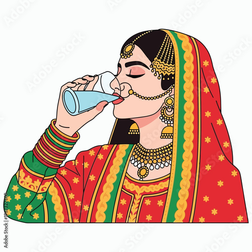 Traditional south asian bride drinking water wearing ornate red bridal lehenga and gold jewelry