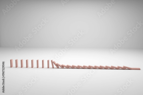 Wooden domino blocks falling on white background